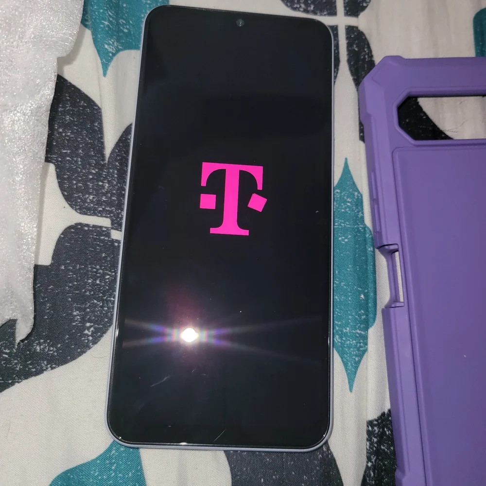 8 White Smartphone with Purple Protective Case